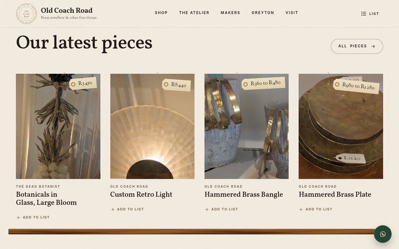 Our latest pieces shelf with price tags on botanicals in glass, a retro light, a brass bangle and a brass plate
