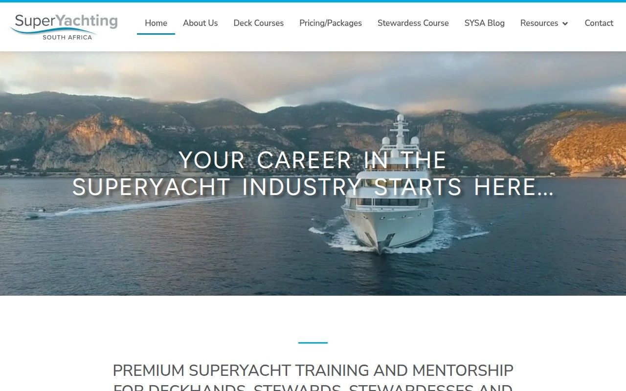 Super Yachting SA homepage hero with a superyacht cruising towards the camera below coastal cliffs